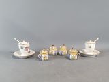 five porcelain cups and saucers with saucers and saucers