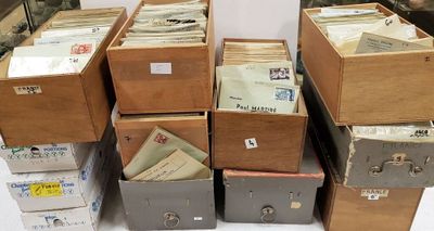 boxes of mail are stacked on top of each other on a table