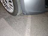 a close up of a car ' s tire on the ground