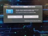 the screen of a computer with a blue button on it