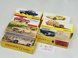 four boxes of toy cars sitting on a table
