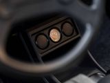 a close up of a car dashboard with a clock on it