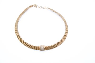 a close up of a gold necklace on a white background