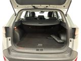 the back of a car with the trunk open and the seats folded down