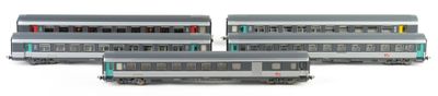 three silver train cars sitting next to each other on a white surface