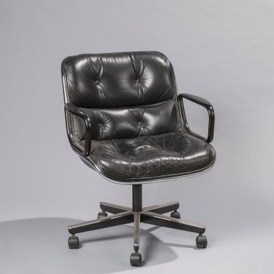 an office chair with a black leather upholstered seat