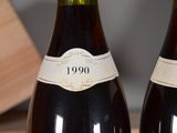 two bottles of wine that are sitting on a table