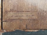 a picture of an old wooden door with a sign on it