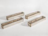 trois jardinières en bois posées sur une surface blanche