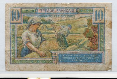 un ancien billet de banque français représentant une femme dans un champ