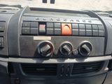 a car dashboard with buttons and controls on it