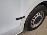 a close up of a tire on a white van