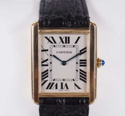 a close up of a watch with roman numerals on the face