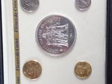 a picture of a picture of some coins in a display case