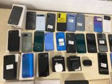 a lot of cell phones that are on the table