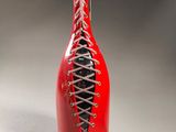 a red wine bottle with laces on it
