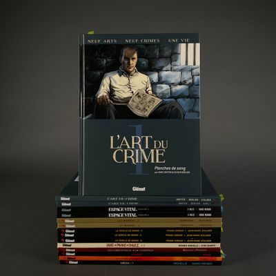 books stacked on top of each other in front of a gray background