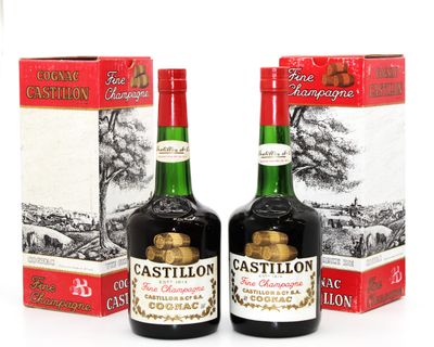 deux bouteilles de vin posées l'une à côté de l'autre sur une table