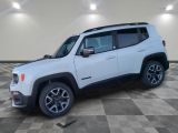 a white jeep is parked in a room with a checkered floor