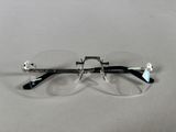 pair of glasses on a table with a white background
