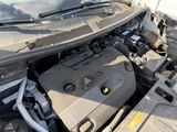 the engine of a car with its hood open and the hood open