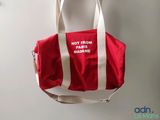 a red and white bag hanging on a wall