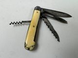 a small swiss army knife with a corkscrew in it