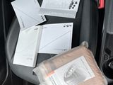 the interior of a car with a lot of items in it