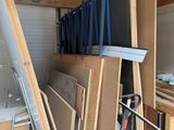 several pieces of wood are stacked on top of each other in a garage