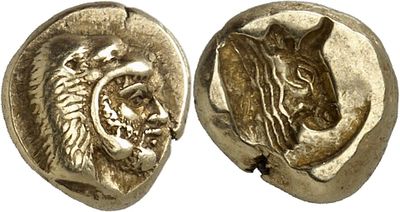 a gold coin with a head of a lion and a head of a lion