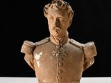 a bust of a man in a military uniform on a table