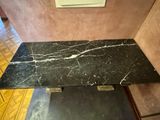 black marble coffee table with gold accents