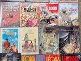 a lot of books that are on the floor