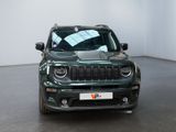 the front of a green jeep renegade parked in a room