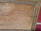an old wooden box that has some writing on it