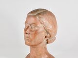 an image of a clay bust of a woman on a white background