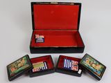 three small wooden boxes with cards in them sitting on a white surface