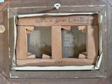 a picture of a picture of a wooden frame with writing on it