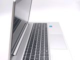 a close up of a laptop computer on a white surface