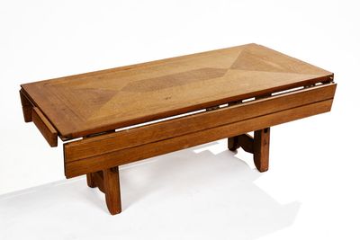 a wooden table with a glass top on a white background