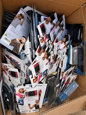 a cardboard box filled with magazines and other items