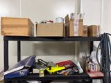 a black shelf with boxes on top of it in a room