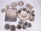 a lot of silver items that are on the table