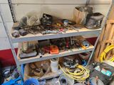 many tools and tools on a shelf in a garage