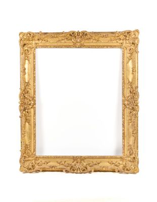 a gold frame with a white background and a white wall
