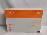 an orange and white box of a tablet on a white surface