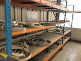 a large rack with many different types of wheels on it