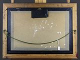 a picture of a painting hanging on a easel