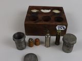 a small wooden box with a lot of small objects in it
