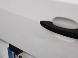 a close up of a door handle on a white car